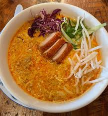 Bida Manda signature dishes Crispy Pork Belly Soup, Green Papaya Salad, Crispy Rice Lettuce Wraps, Pad Thai